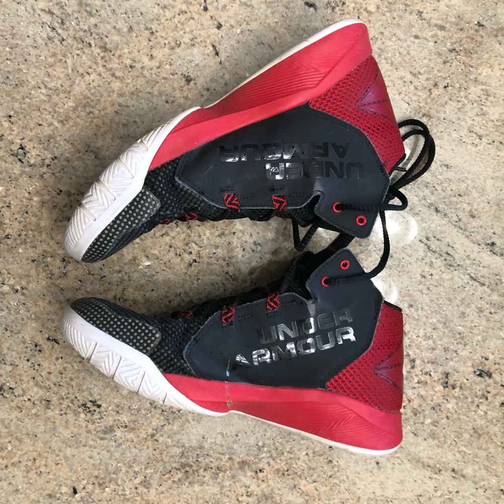 Red and black under armour basketball shoes
